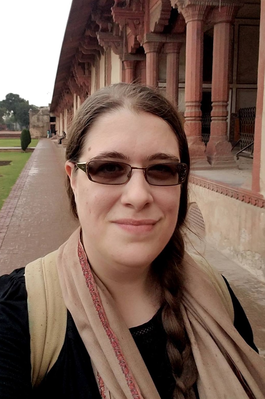PGR Brittni Bradford smiling standing next to a museum building